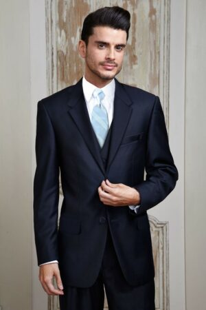 A man wears his navy colored Aspen suit rental