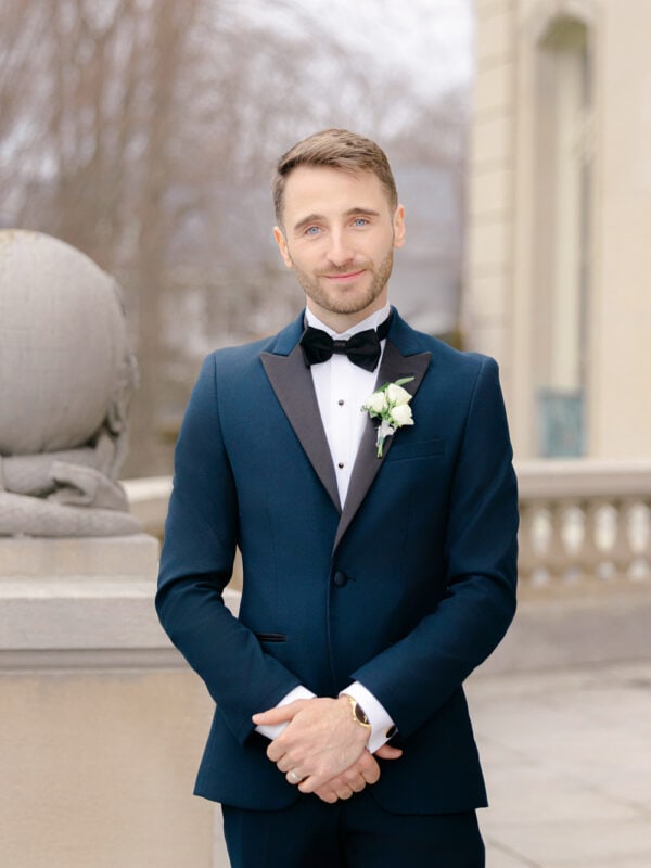 man wearing navy and black tuxedo