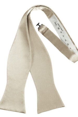Beige necktie with a silver measuring tape along the inner edge.