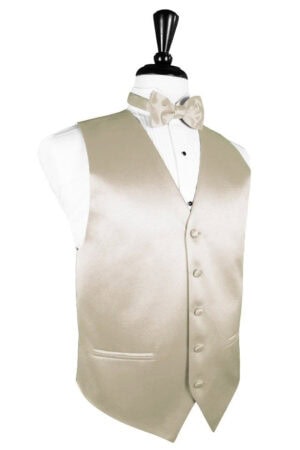 Beige satin waistcoat with a matching bow tie on a dress form over a white shirt.