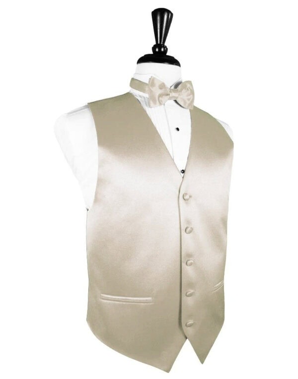Beige satin waistcoat with a matching bow tie on a dress form over a white shirt.