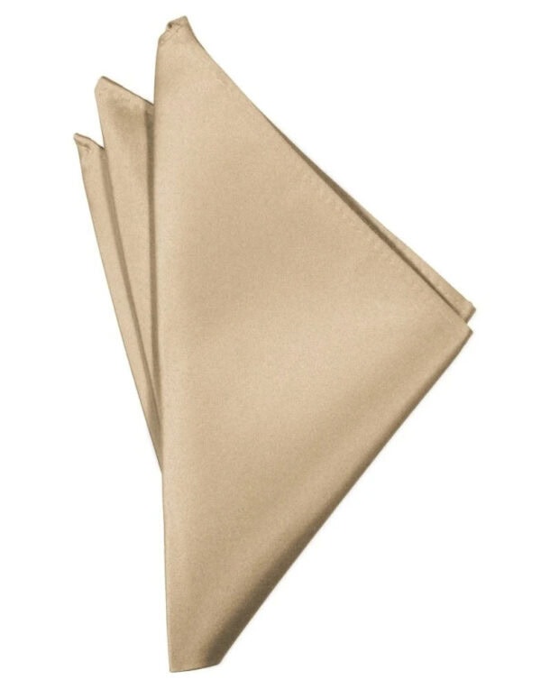 Gold satin napkin folded into a triangle with layered folds on a white background, showing three overlapping napkins