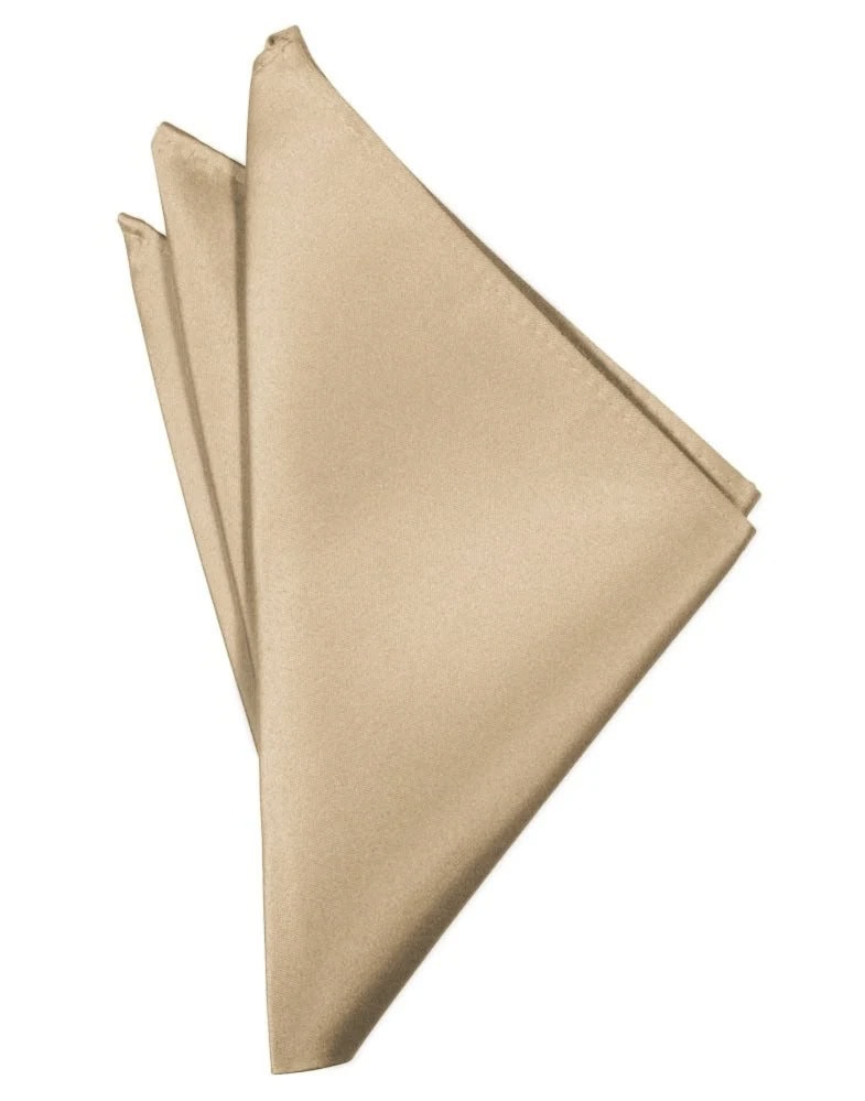 Gold satin napkin folded into a triangle with layered folds on a white background, showing three overlapping napkins