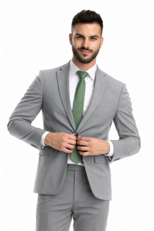 man wearing a heather grey suit rental with sage green tie