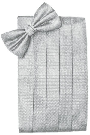 Gray herringbone-patterned blanket neatly folded with a large matching bow on top.