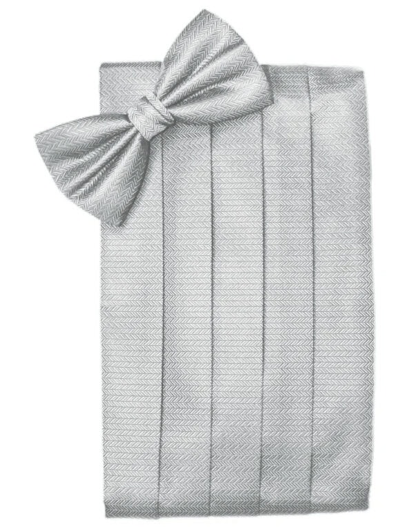 Gray herringbone-patterned blanket neatly folded with a large matching bow on top.