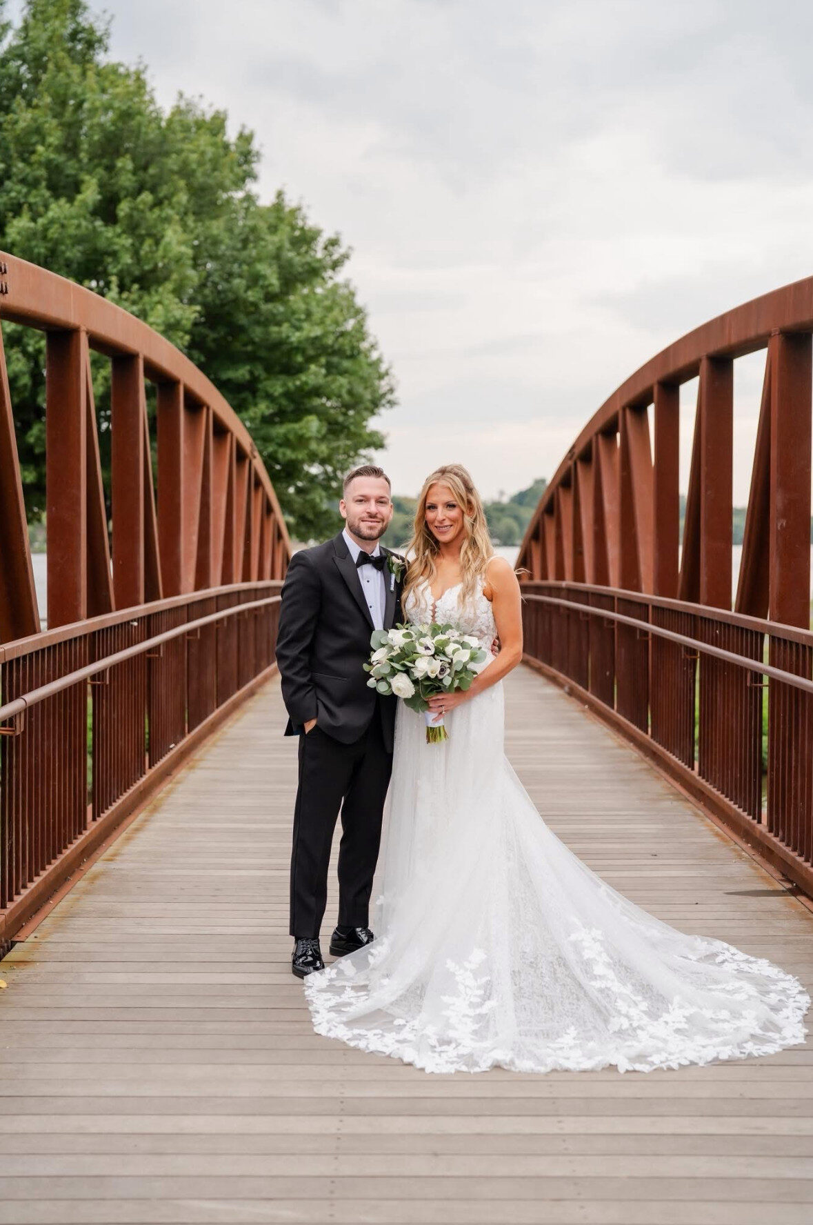 blackpeaktuxedo | National Tuxedo Rentals bride and groom on bridge