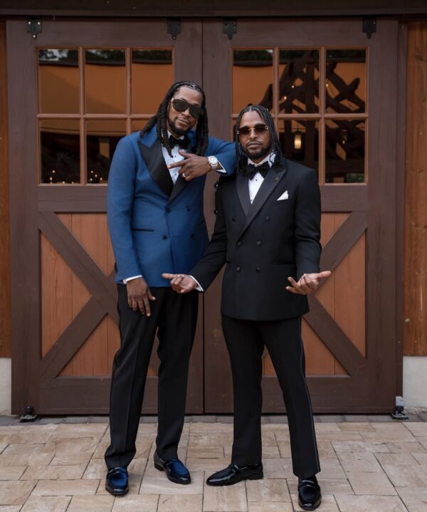 groom and groomsman dressed in tuxedo rentals
