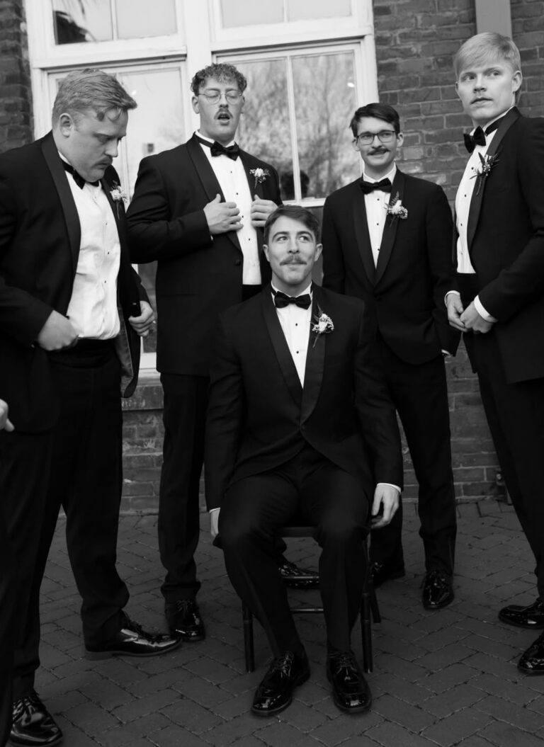 groom and groomsmen in black shawl tuxedo rentals
