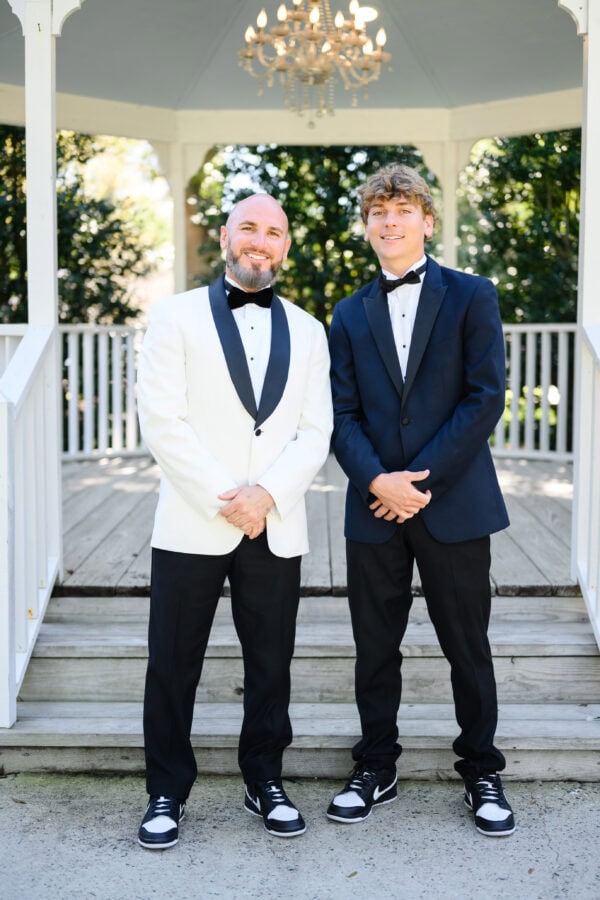 two men wearing tuxedo rentals