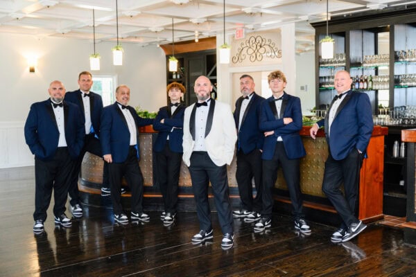 wedding party wearing navy tuxedo rentals