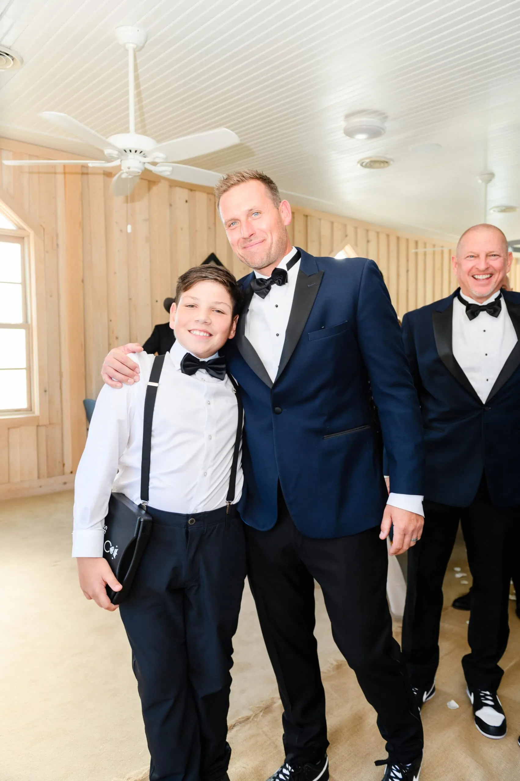 Shannon and Eddie Wedding Day | National Tuxedo Rentals Man and bow wearing tuxedo rentals at weedding