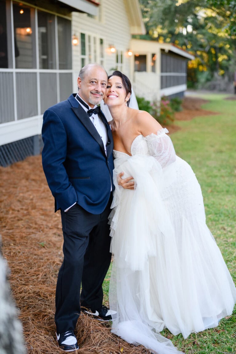 bride and her father smiling at wedding