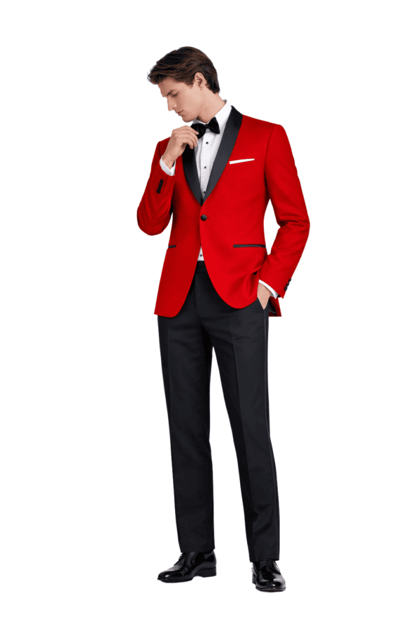 A model poses wearing a red london Shawl tuxedo rental.