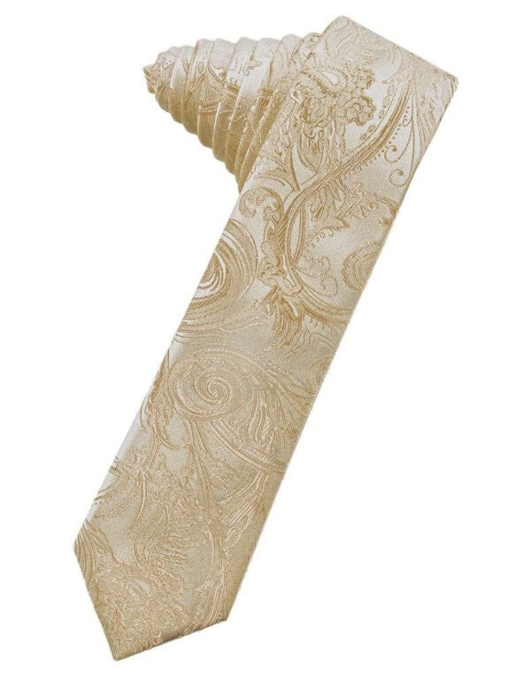 Beige/gold paisley-patterned necktie laid diagonally with the tip pointing down-left.