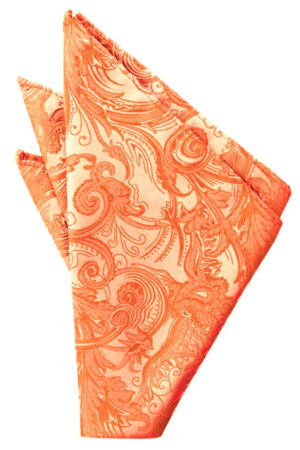 Orange patterned cloth napkin folded into a triangle on a white background