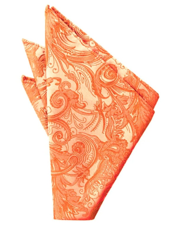 Orange patterned cloth napkin folded into a triangle on a white background