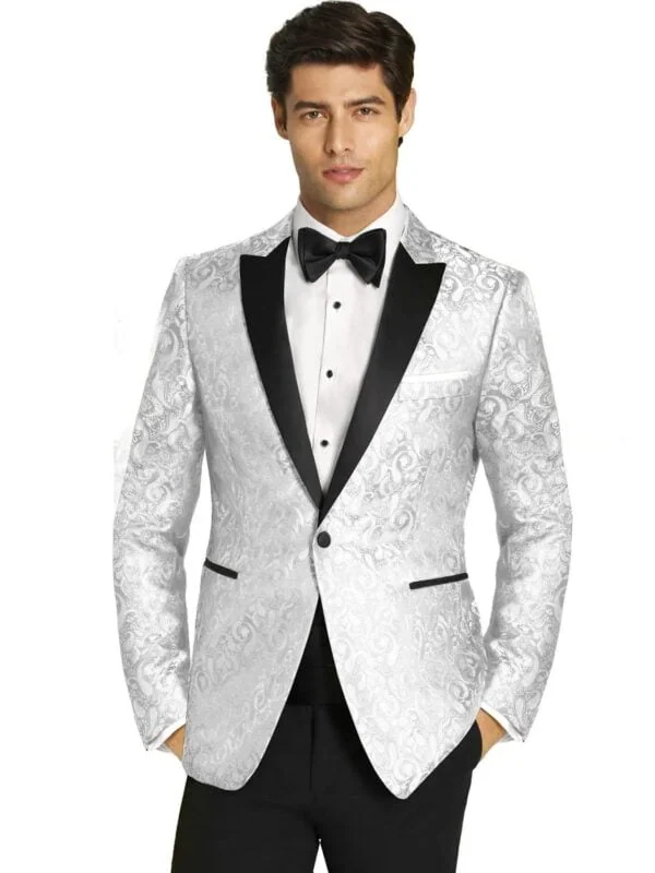 a man wearing a white paisley tuxedo rental