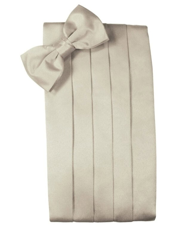 Beige gift box with a large satin bow at the top-left corner and vertical ribbon folds along the sides.