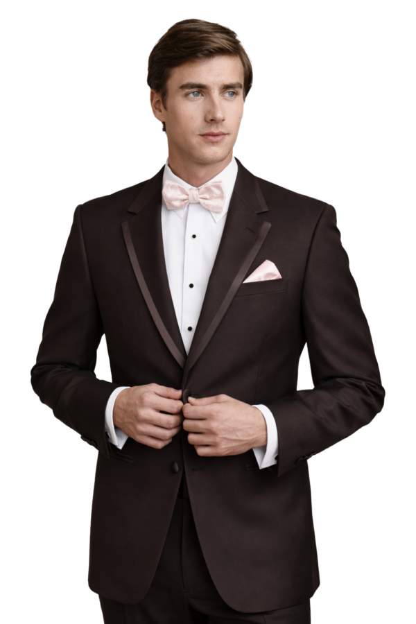 A young man wears the chocolate brown edge tuxedo package.