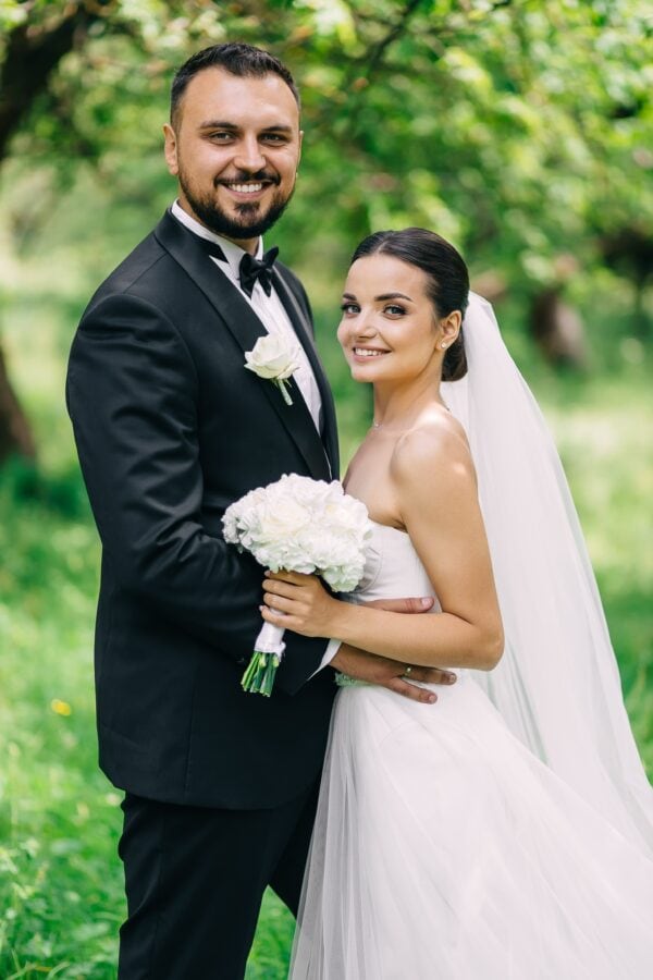 bride and groom wearing black shawl tuxedo rental