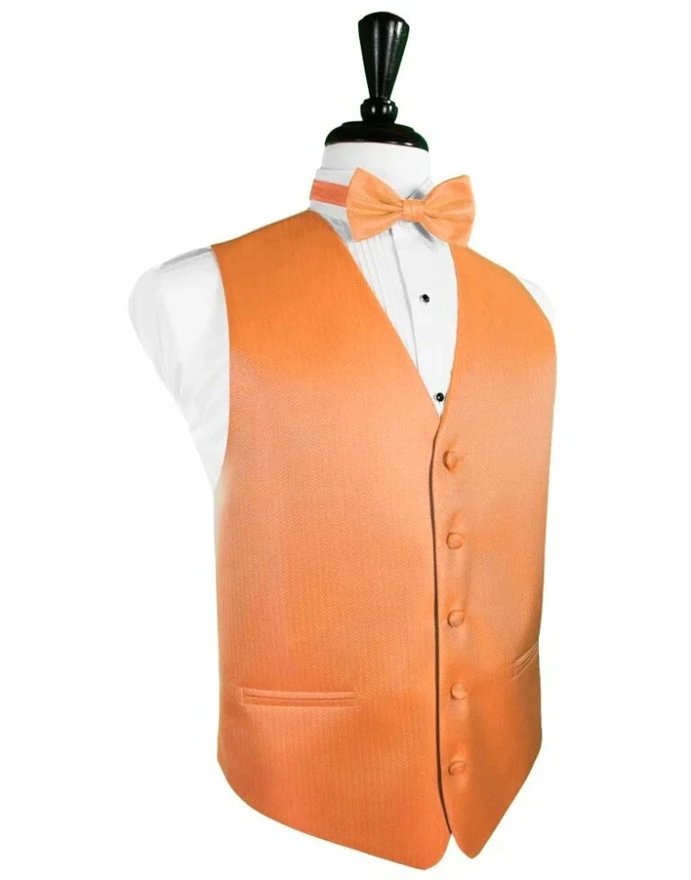 Orange formal waistcoat with matching bow tie over a white dress shirt on a mannequin,Display wear for a smart occasion