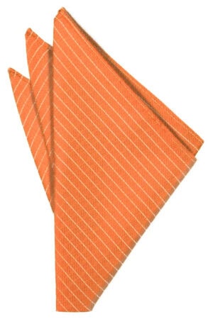 Orange striped cloth napkin neatly folded into a triangular shape for a table setting.
