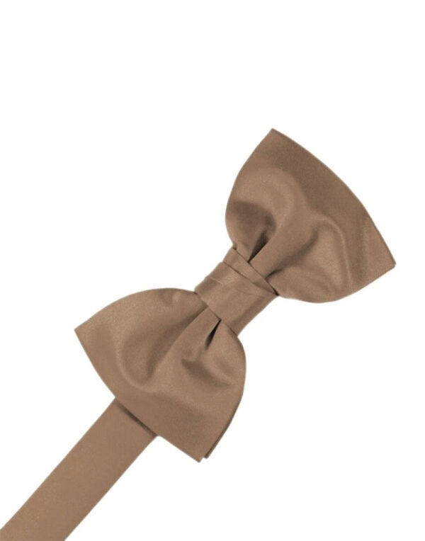 Brown fabric bow tie with a short adjustable strap, shown against a white background, laid diagonally to the left.