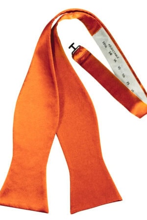 Orange fashion scarf with a white measuring-tape-like inner edge, draped in a loose loop for decorative wear.