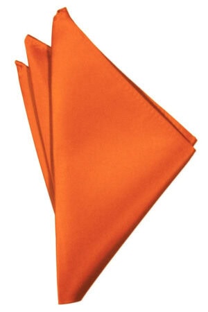 Orange cloth napkin folded into a geometric, fan-like shape against a white background.