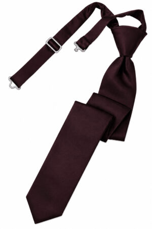 Burgundy necktie with matching suspenders laid out, showing metal clips and a tied knot