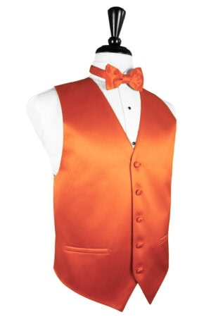 Orange satin vest with matching orange bow tie over a white dress shirt on a mannequin, showcasing formal wear.
