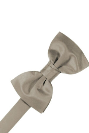 Beige satin bow tie tied in a knot against a white background.