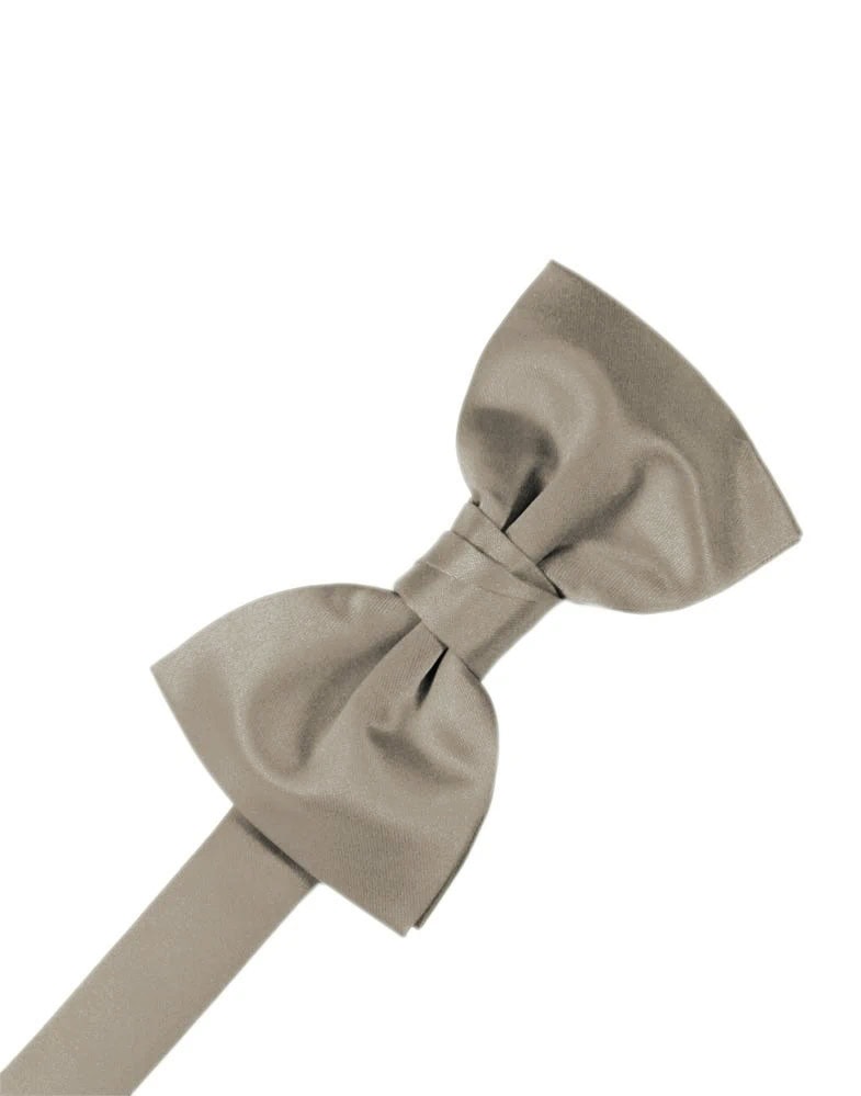 Beige satin bow tie tied in a knot against a white background.