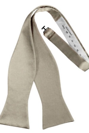 Beige satin scarf draped with a white measuring tape showing measurement marks.