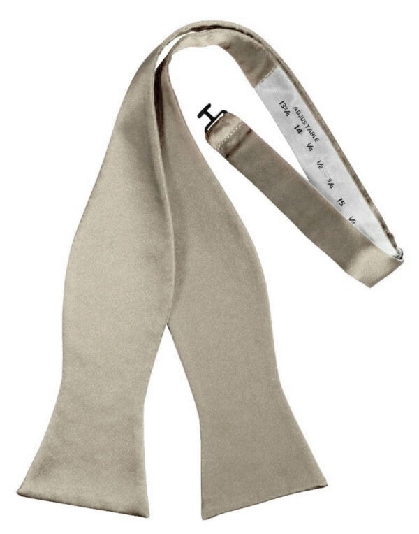 Beige satin scarf draped with a white measuring tape showing measurement marks.