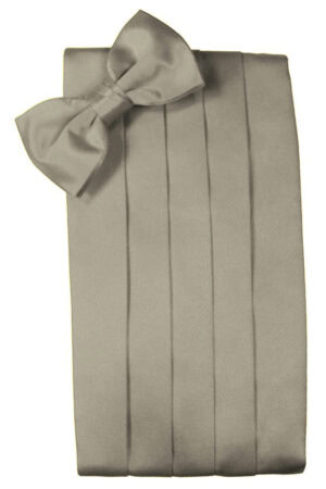 A wrapped gift with a large bow on top, vertical ribbon detailing the wrapping paper resembles a tall present ready for gifting.