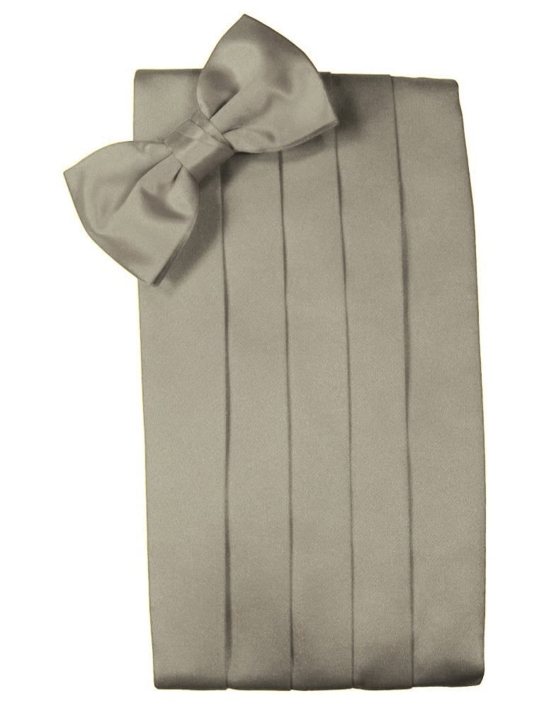 A wrapped gift with a large bow on top, vertical ribbon detailing the wrapping paper resembles a tall present ready for gifting.