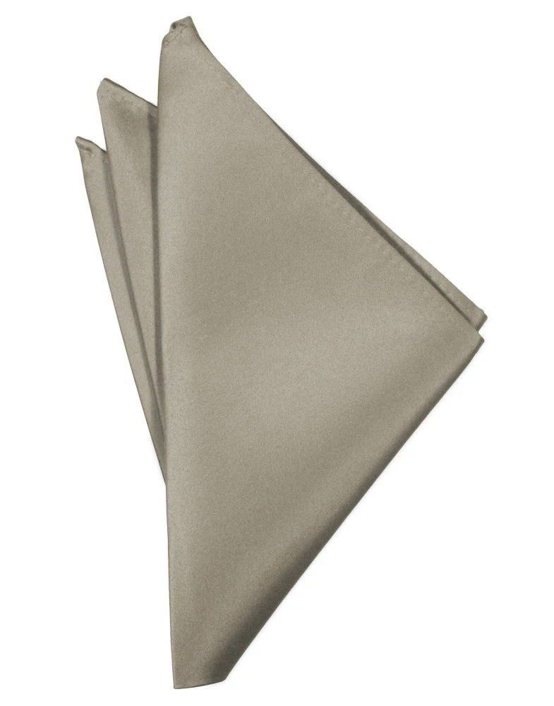 Beige fabric napkin neatly folded into a layered triangular fan shape.