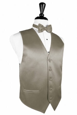 Mannequin dressed in a beige formal vest, white shirt, and matching bow tie on a stand