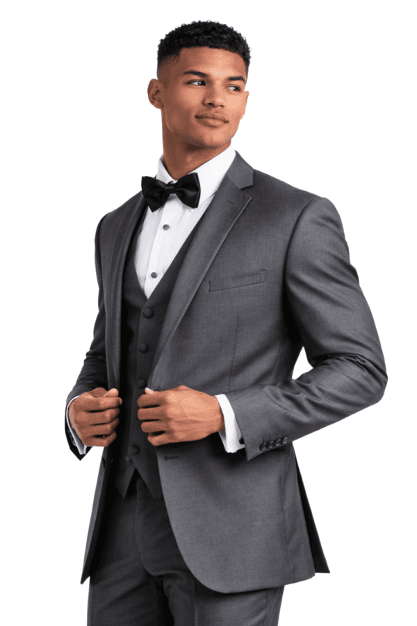 A handsome man poses wearing the Infinity tuxedo rental in steel gray.