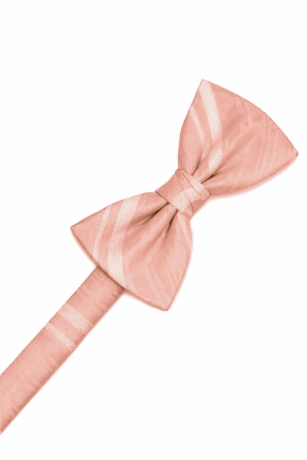 Pink bow tie on a white background, close-up view of the fabric and knot.