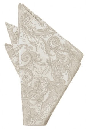 Beige damask-patterned napkin folded into a triangle shape, decorative textile.