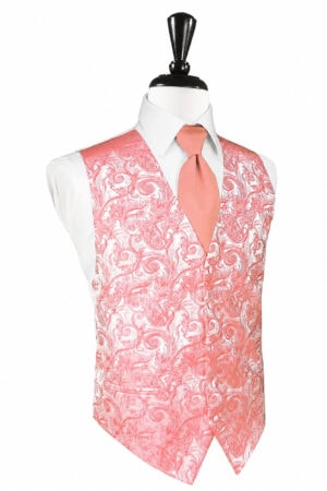 Pink paisley-patterned men's vest over a white dress shirt with a peach tie on a mannequin.