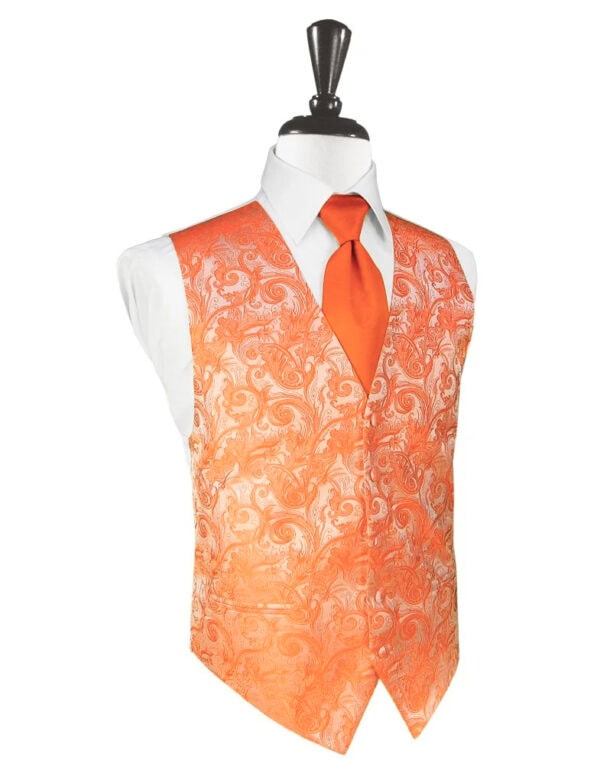 Orange patterned waistcoat over a white shirt with an orange tie on a mannequin (formal menswear)