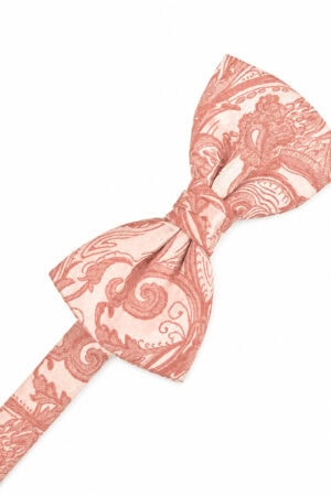 Pink patterned bow tie with an ornate paisley/damask design on a white background