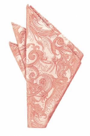 Decorative pink damask-patterned cloth napkin folded into a triangle