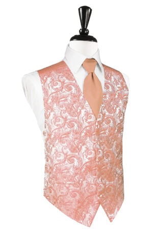 Pink paisley-patterned vest worn over a white dress shirt with a peach tie on a mannequin.