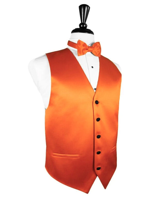 Orange satin waistcoat with matching bow tie on a dress form, white shirt underneath, black buttons, formal attire display.