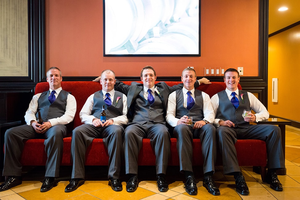 Groom and his men pose together on a couch